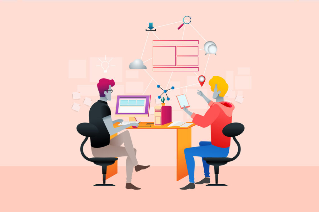 Two people sitting at a computer